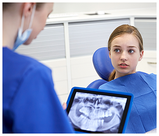 Hygienist Reviewing X-Rays with Patient in Goldsboro, NC 